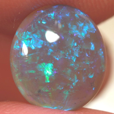 SOLID BLACK CRYSTAL OPAL Rolling flashes of green and turquoise fire in a 3D pattern